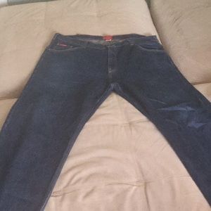 Men’s dark wash denim jeans.